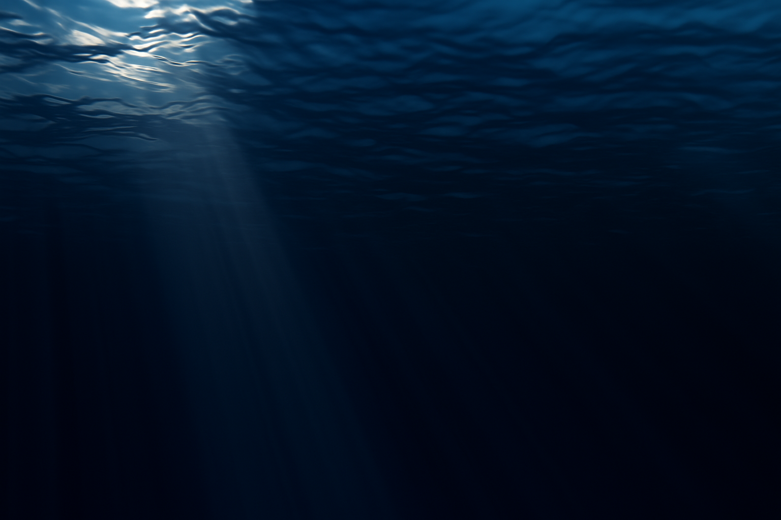 Fincantieri - Investor Relations Strategia: Vista subacquea di acque oceaniche blu profonde, raggi di luce solare filtrano dalla superficie illuminando la scena, atmosfera calma e misteriosa, enfasi sulla bellezza dell’ambiente marino.